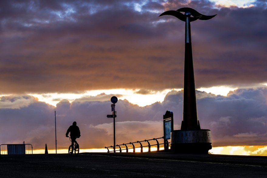 A cyclist riding along the promenade at Southport